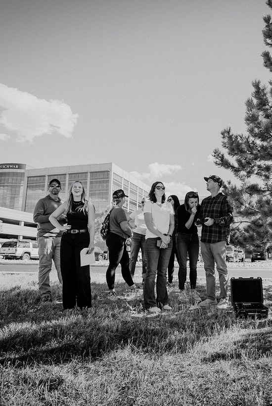 Kinetic Studios team monitoring drone with client